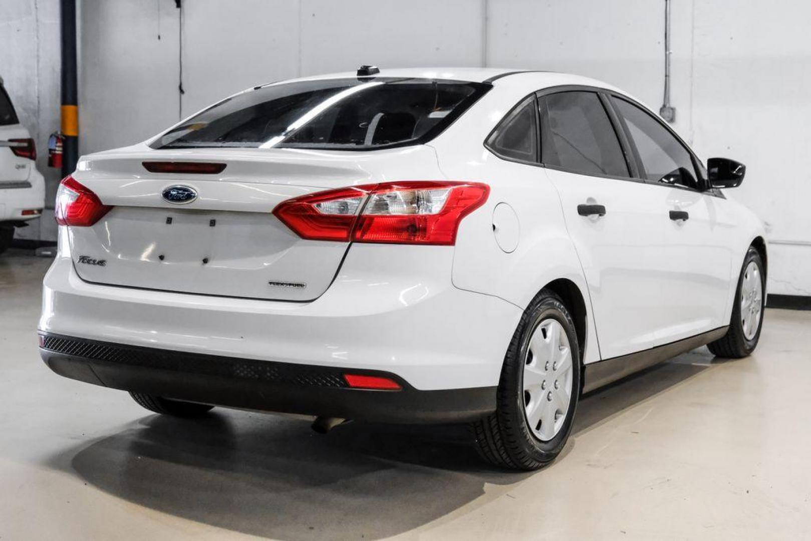 2014 Oxford White /Black Ford Focus S (1FADP3E24EL) with an 2.0L 4-Cylinder DGI Flex Fuel DOHC engine, Automatic transmission, located at 15300 Midway Rd., Addison, TX, 75001, (972) 702-0011, 32.958321, -96.838074 - Photo#7