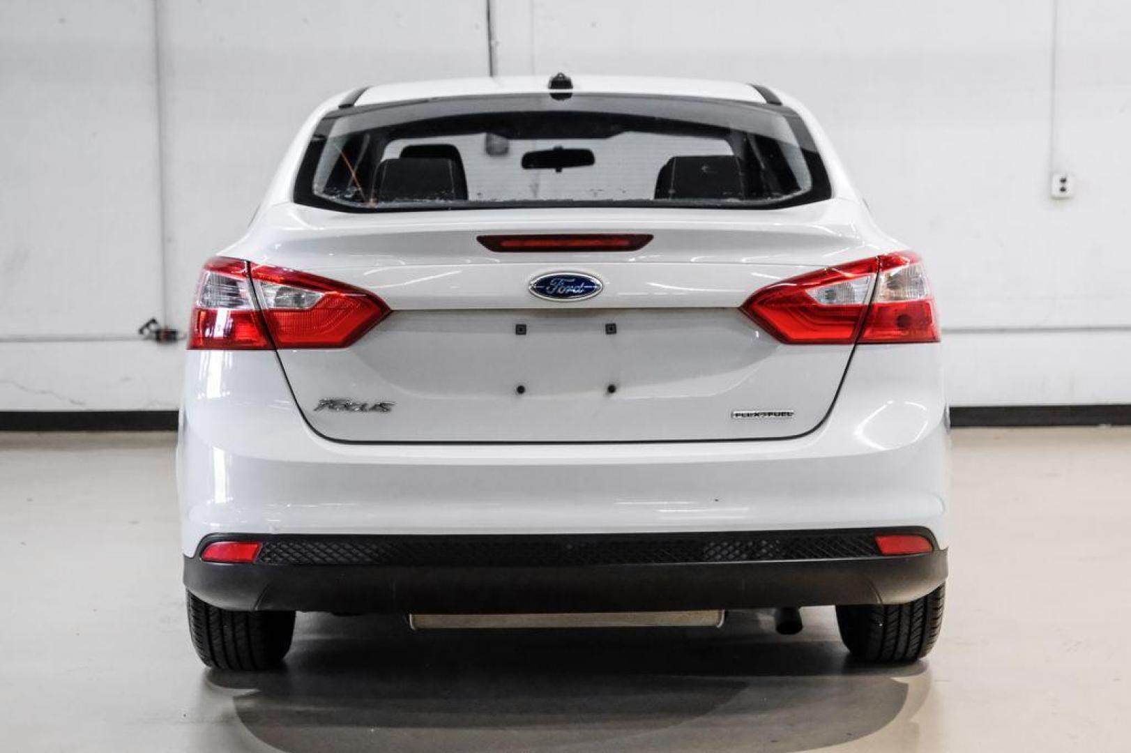 2014 Oxford White /Black Ford Focus S (1FADP3E24EL) with an 2.0L 4-Cylinder DGI Flex Fuel DOHC engine, Automatic transmission, located at 15300 Midway Rd., Addison, TX, 75001, (972) 702-0011, 32.958321, -96.838074 - Photo#8