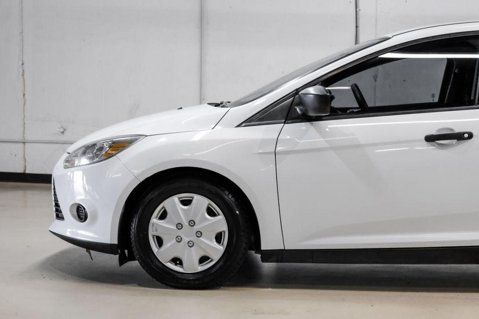 2014 Oxford White /Black Ford Focus S (1FADP3E24EL) with an 2.0L 4-Cylinder DGI Flex Fuel DOHC engine, Automatic transmission, located at 15300 Midway Rd., Addison, TX, 75001, (972) 702-0011, 32.958321, -96.838074 - Photo#11