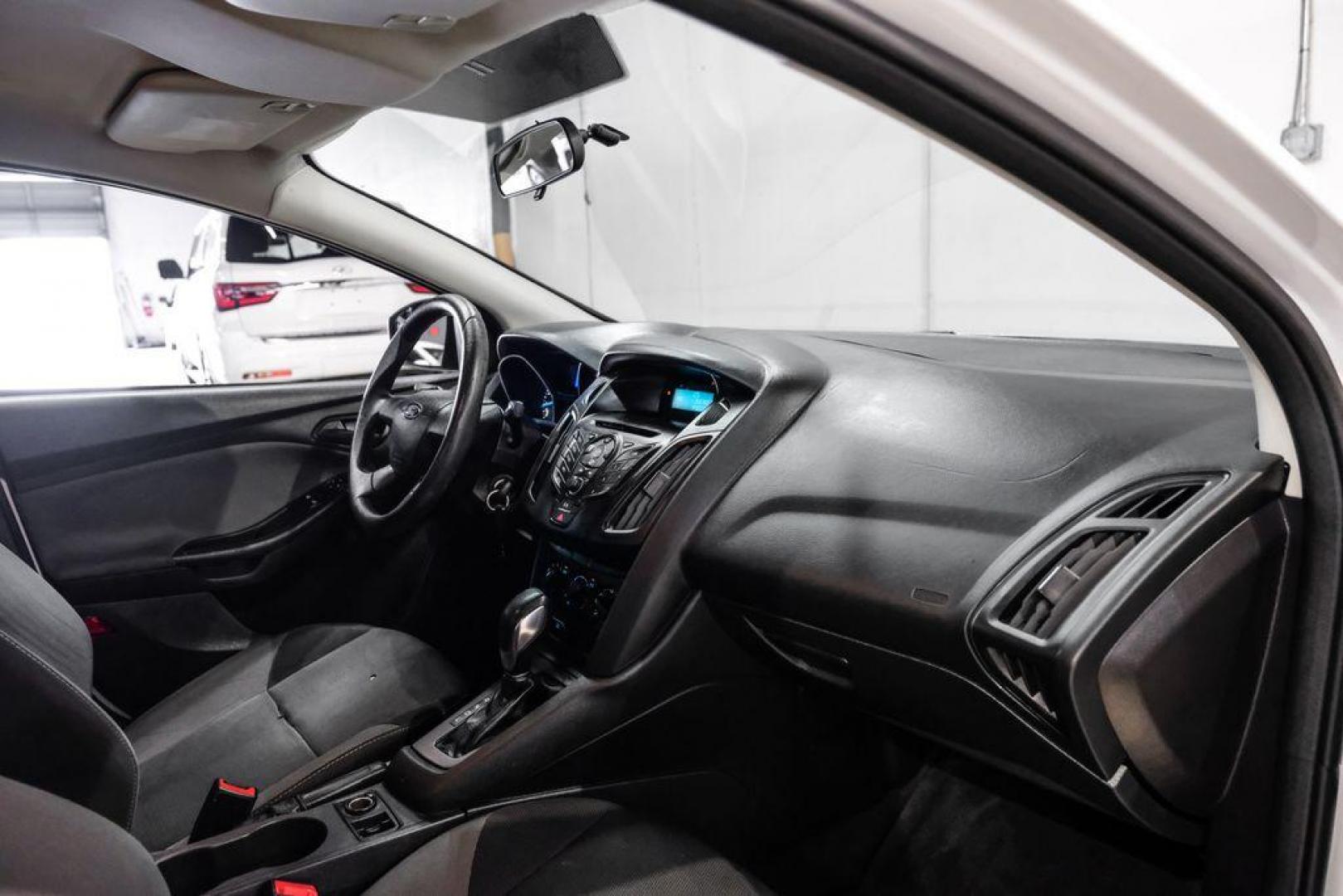 2014 Oxford White /Black Ford Focus S (1FADP3E24EL) with an 2.0L 4-Cylinder DGI Flex Fuel DOHC engine, Automatic transmission, located at 15300 Midway Rd., Addison, TX, 75001, (972) 702-0011, 32.958321, -96.838074 - Photo#13