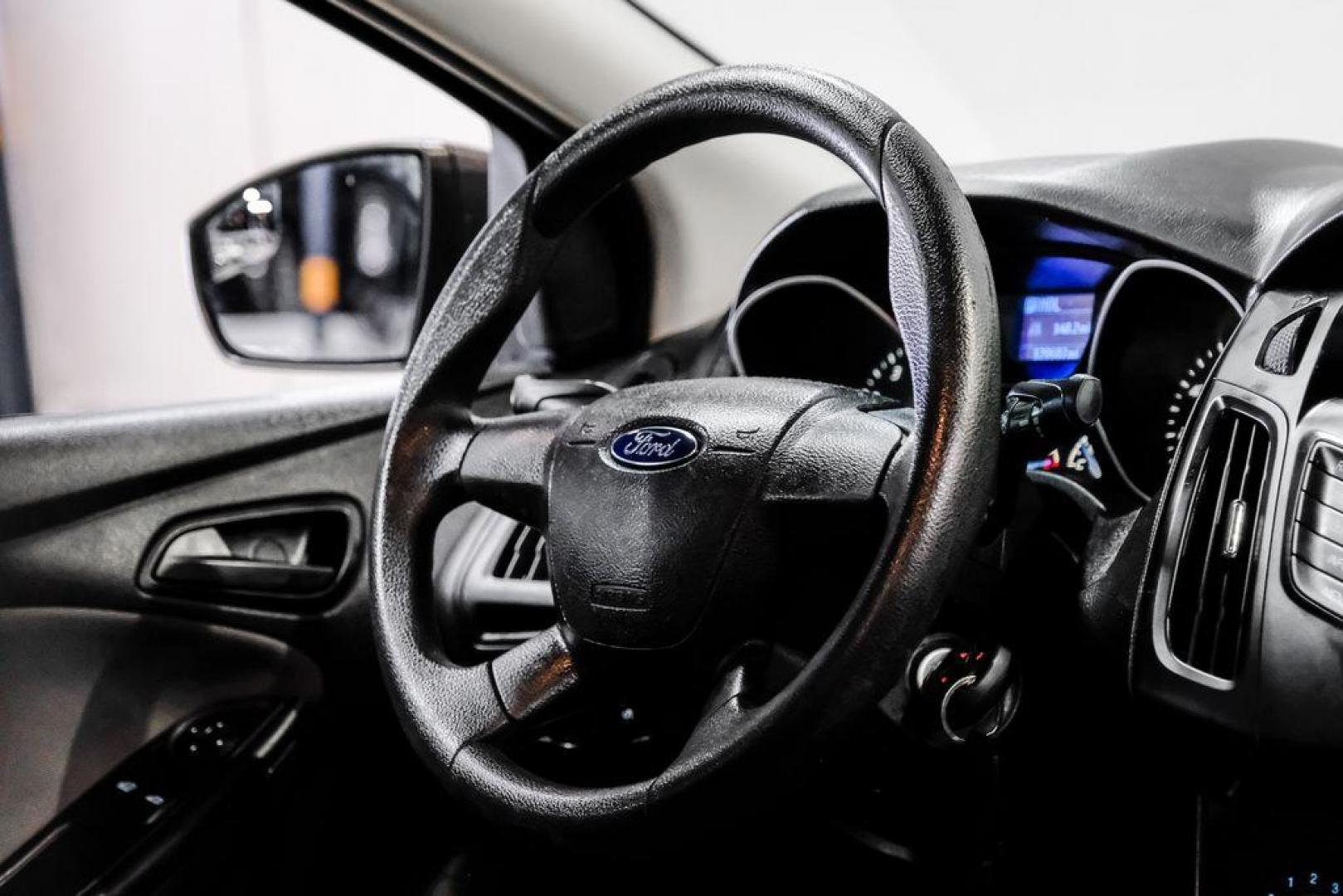 2014 Oxford White /Black Ford Focus S (1FADP3E24EL) with an 2.0L 4-Cylinder DGI Flex Fuel DOHC engine, Automatic transmission, located at 15300 Midway Rd., Addison, TX, 75001, (972) 702-0011, 32.958321, -96.838074 - Photo#15