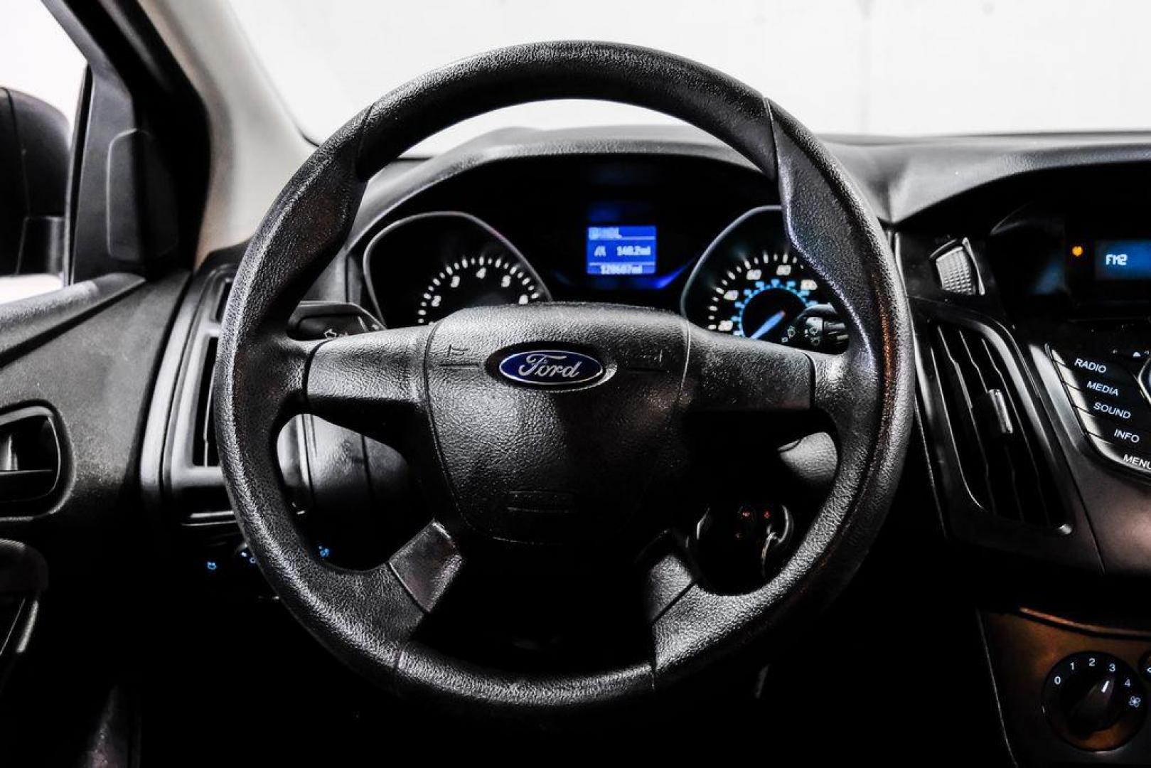 2014 Oxford White /Black Ford Focus S (1FADP3E24EL) with an 2.0L 4-Cylinder DGI Flex Fuel DOHC engine, Automatic transmission, located at 15300 Midway Rd., Addison, TX, 75001, (972) 702-0011, 32.958321, -96.838074 - Photo#16