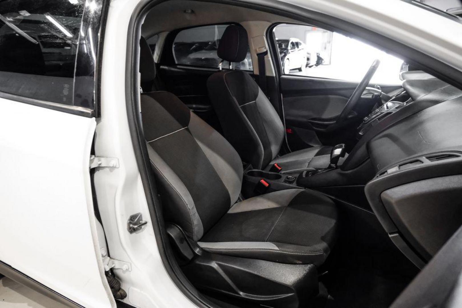 2014 Oxford White /Black Ford Focus S (1FADP3E24EL) with an 2.0L 4-Cylinder DGI Flex Fuel DOHC engine, Automatic transmission, located at 15300 Midway Rd., Addison, TX, 75001, (972) 702-0011, 32.958321, -96.838074 - Photo#24