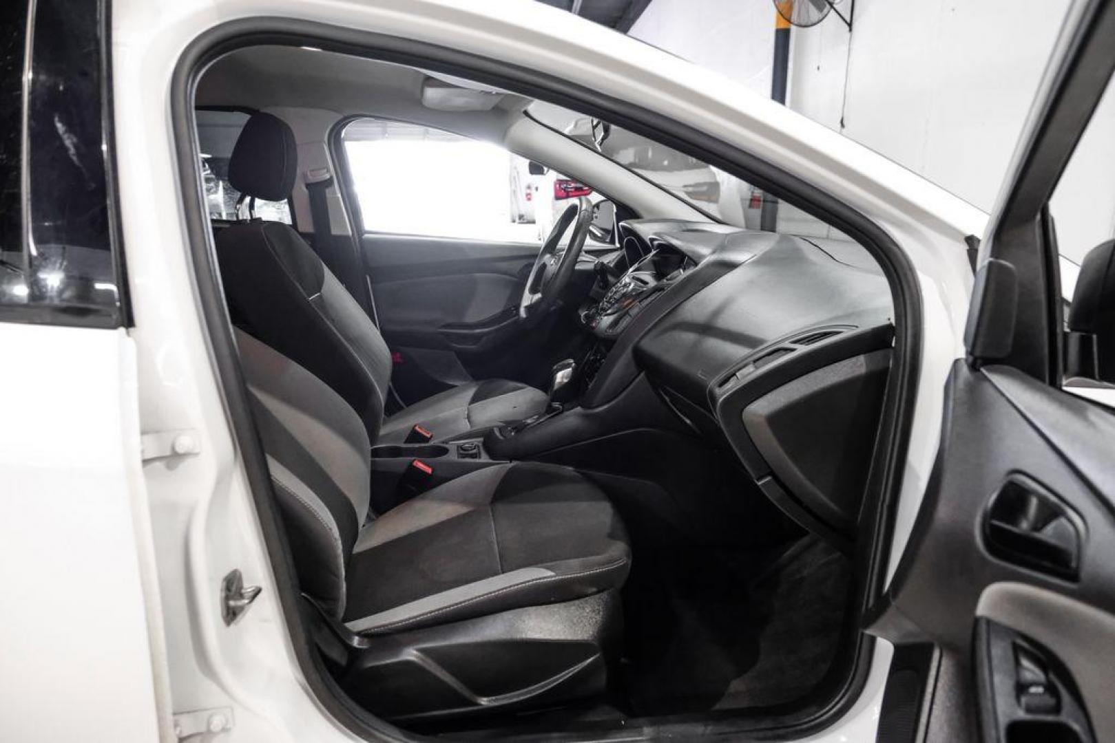 2014 Oxford White /Black Ford Focus S (1FADP3E24EL) with an 2.0L 4-Cylinder DGI Flex Fuel DOHC engine, Automatic transmission, located at 15300 Midway Rd., Addison, TX, 75001, (972) 702-0011, 32.958321, -96.838074 - Photo#25