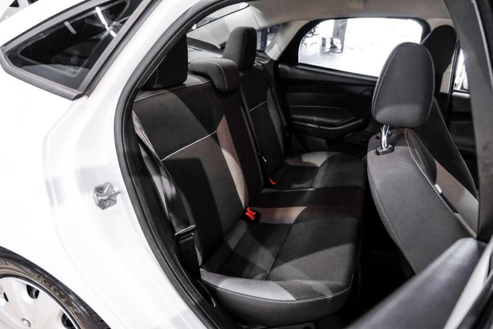 2014 Oxford White /Black Ford Focus S (1FADP3E24EL) with an 2.0L 4-Cylinder DGI Flex Fuel DOHC engine, Automatic transmission, located at 15300 Midway Rd., Addison, TX, 75001, (972) 702-0011, 32.958321, -96.838074 - Photo#26
