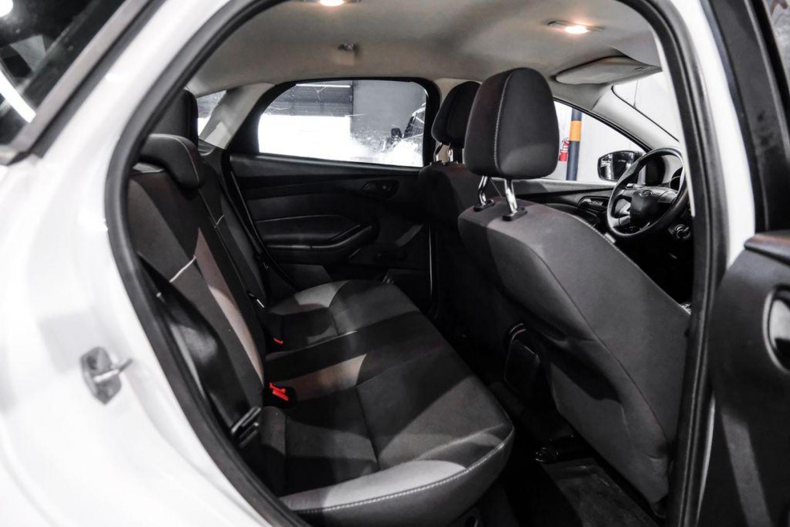 2014 Oxford White /Black Ford Focus S (1FADP3E24EL) with an 2.0L 4-Cylinder DGI Flex Fuel DOHC engine, Automatic transmission, located at 15300 Midway Rd., Addison, TX, 75001, (972) 702-0011, 32.958321, -96.838074 - Photo#27