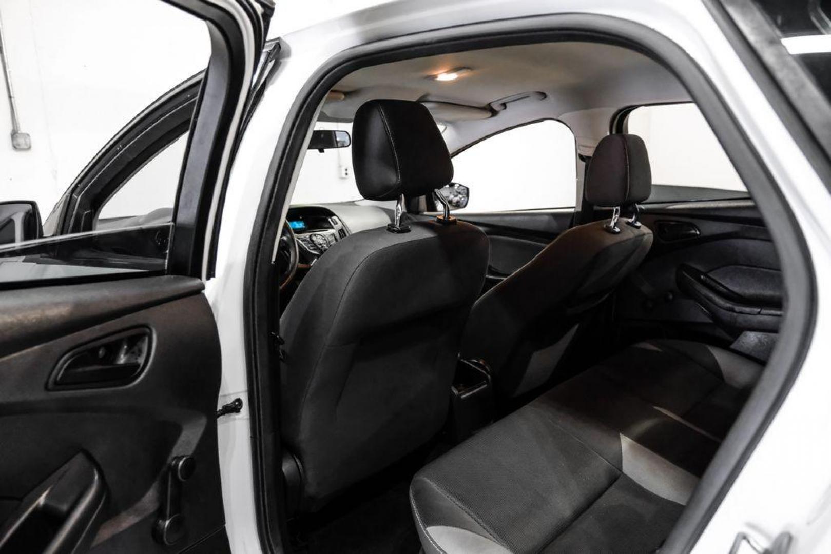 2014 Oxford White /Black Ford Focus S (1FADP3E24EL) with an 2.0L 4-Cylinder DGI Flex Fuel DOHC engine, Automatic transmission, located at 15300 Midway Rd., Addison, TX, 75001, (972) 702-0011, 32.958321, -96.838074 - Photo#28