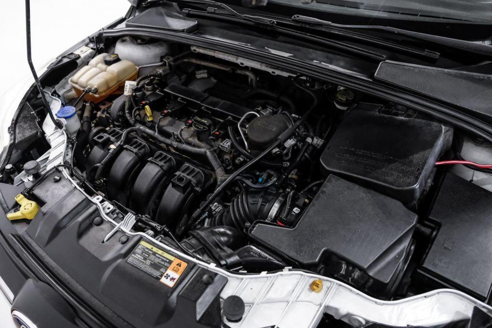 2014 Oxford White /Black Ford Focus S (1FADP3E24EL) with an 2.0L 4-Cylinder DGI Flex Fuel DOHC engine, Automatic transmission, located at 15300 Midway Rd., Addison, TX, 75001, (972) 702-0011, 32.958321, -96.838074 - Photo#39