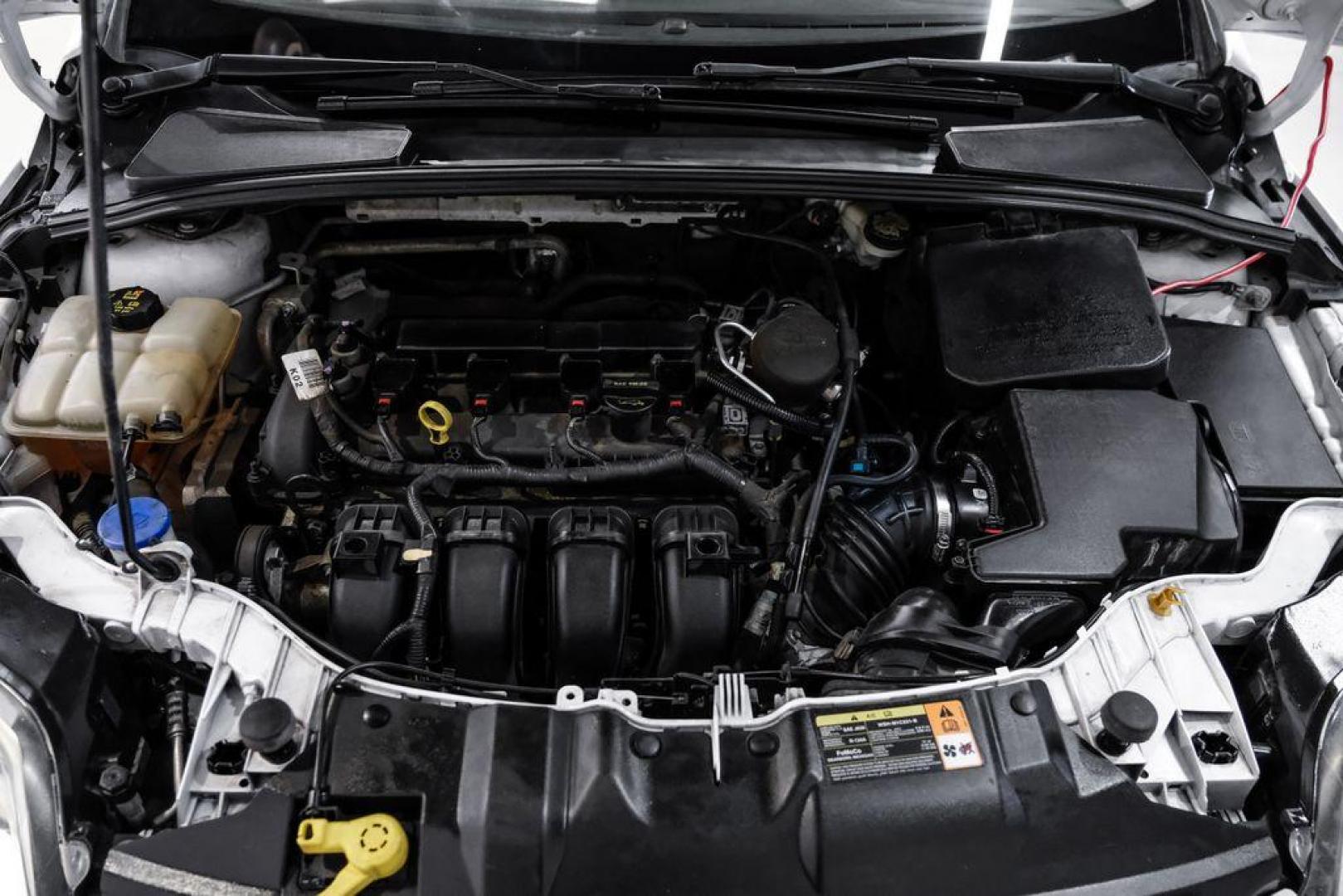 2014 Oxford White /Black Ford Focus S (1FADP3E24EL) with an 2.0L 4-Cylinder DGI Flex Fuel DOHC engine, Automatic transmission, located at 15300 Midway Rd., Addison, TX, 75001, (972) 702-0011, 32.958321, -96.838074 - Photo#40
