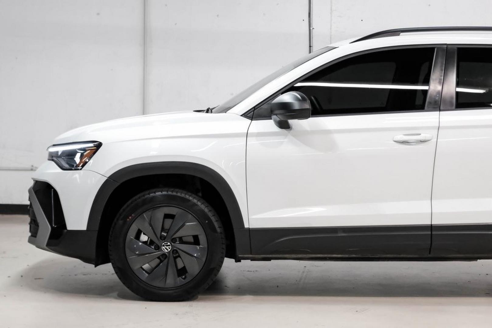 2025 Pure White /Black/White Volkswagen Taos 1.5T S (3VV5C7B2XSM) with an 1.5L I4 Turbocharged DOHC 16V LEV3-SULEV30 174hp engine, Automatic transmission, located at 15300 Midway Rd., Addison, TX, 75001, (972) 702-0011, 32.958321, -96.838074 - Photo#11