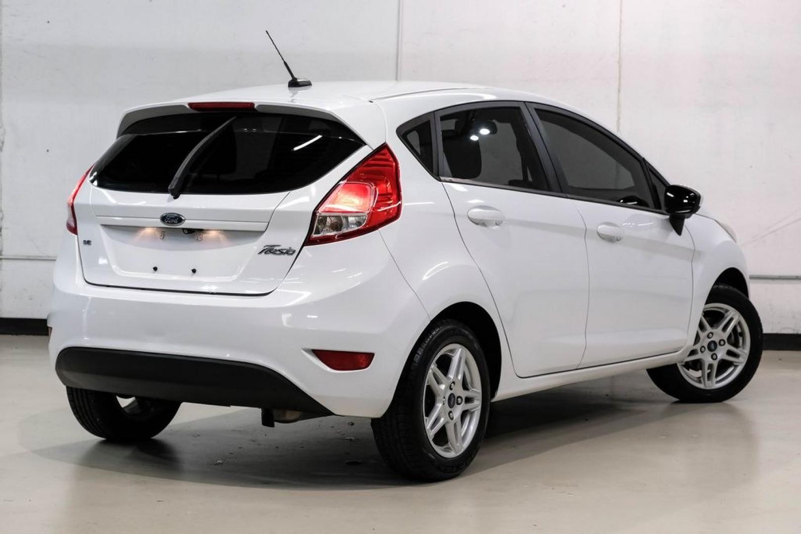 2019 Oxford White /Black Ford Fiesta SE (3FADP4EJXKM) with an 1.6L I4 Ti-VCT engine, Automatic transmission, located at 15300 Midway Rd., Addison, TX, 75001, (972) 702-0011, 32.958321, -96.838074 - Photo#7