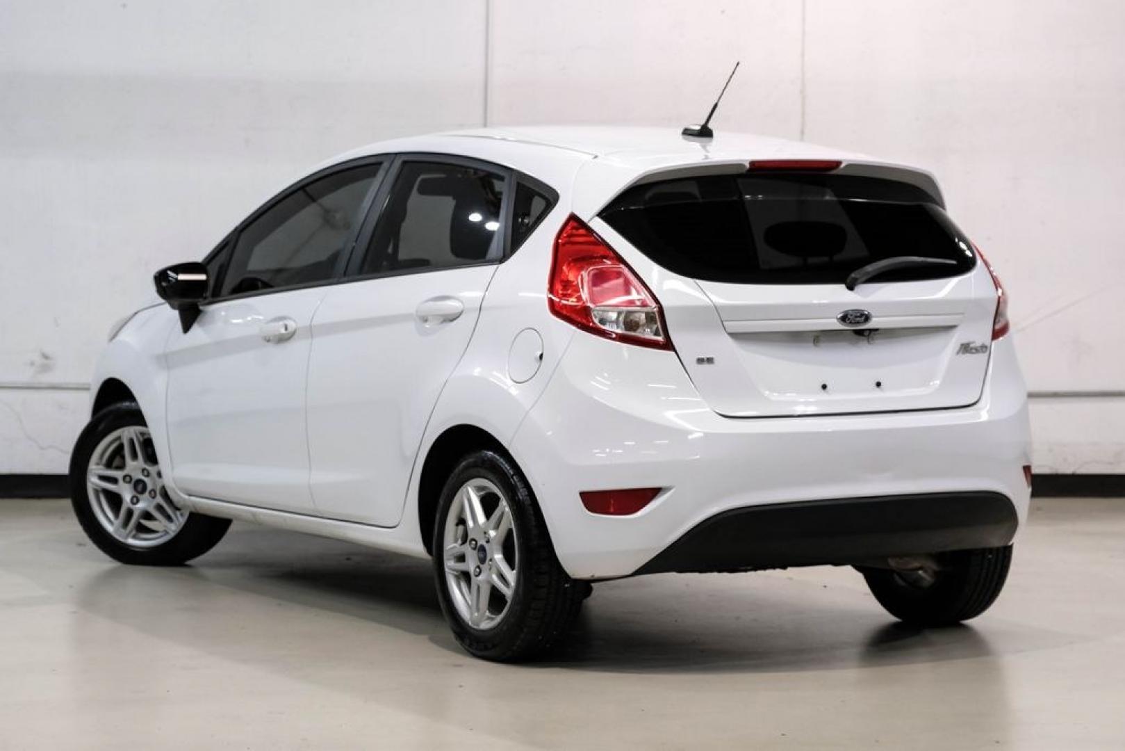 2019 Oxford White /Black Ford Fiesta SE (3FADP4EJXKM) with an 1.6L I4 Ti-VCT engine, Automatic transmission, located at 15300 Midway Rd., Addison, TX, 75001, (972) 702-0011, 32.958321, -96.838074 - Photo#9