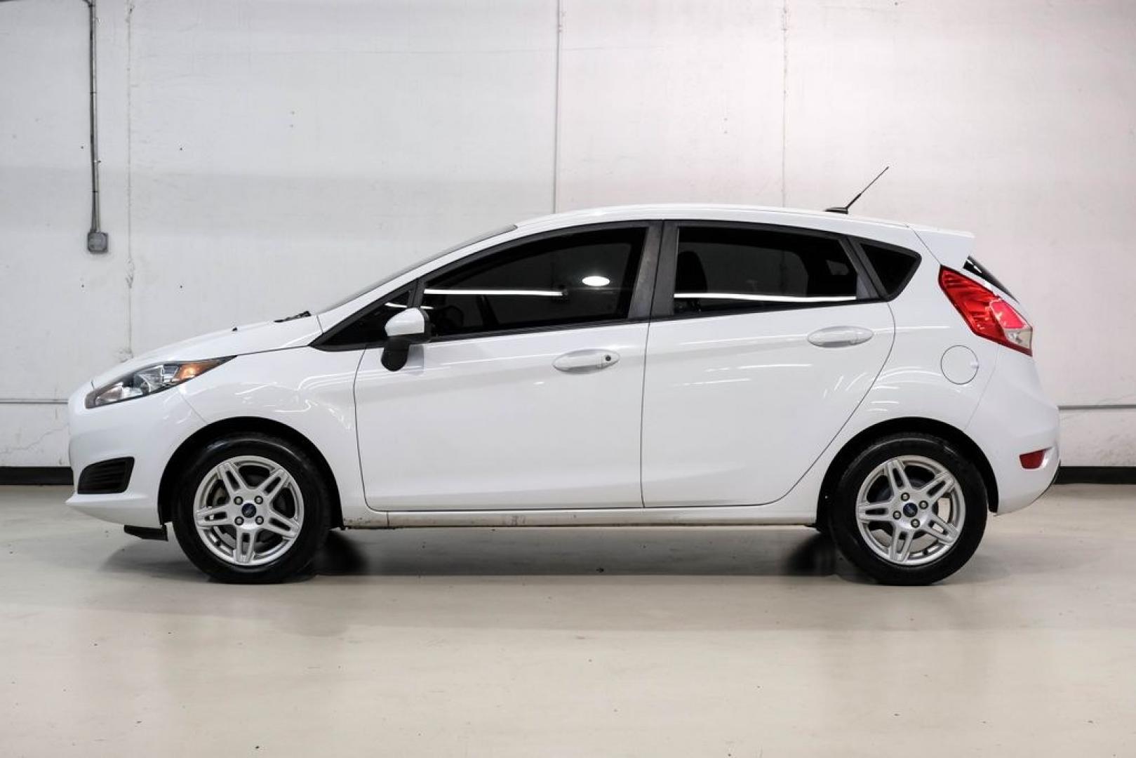 2019 Oxford White /Black Ford Fiesta SE (3FADP4EJXKM) with an 1.6L I4 Ti-VCT engine, Automatic transmission, located at 15300 Midway Rd., Addison, TX, 75001, (972) 702-0011, 32.958321, -96.838074 - Photo#10