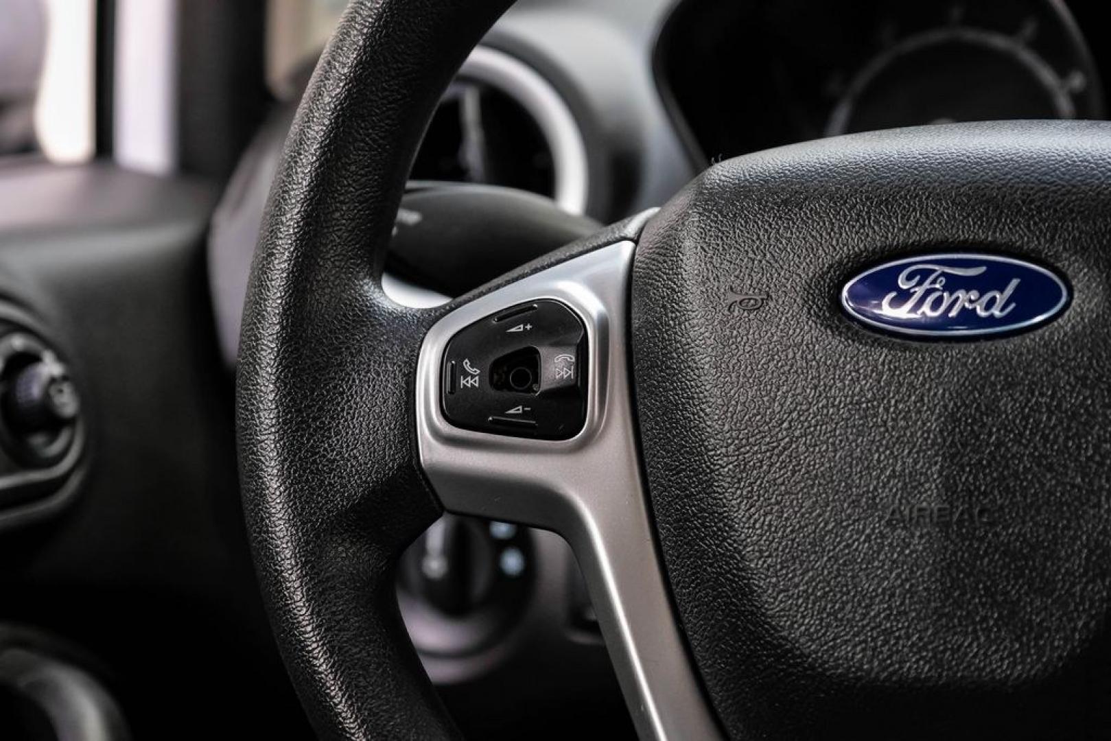 2019 Oxford White /Black Ford Fiesta SE (3FADP4EJXKM) with an 1.6L I4 Ti-VCT engine, Automatic transmission, located at 15300 Midway Rd., Addison, TX, 75001, (972) 702-0011, 32.958321, -96.838074 - Photo#16