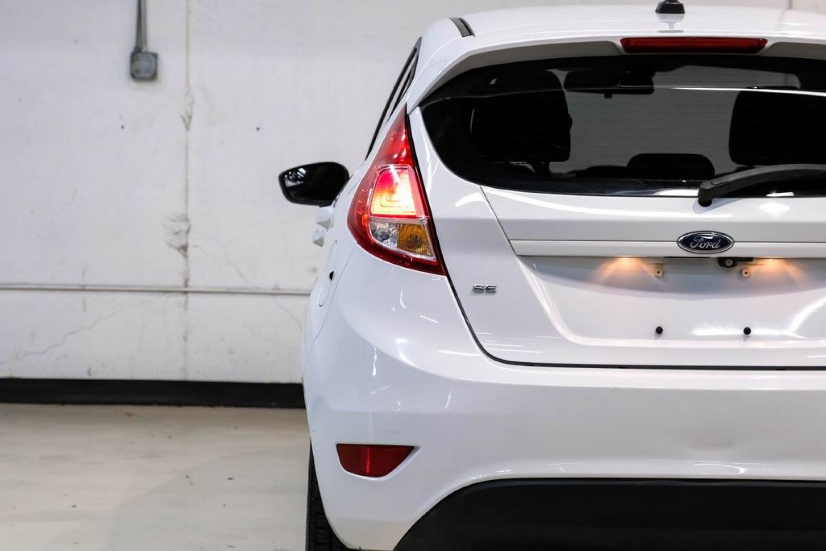 2019 Oxford White /Black Ford Fiesta SE (3FADP4EJXKM) with an 1.6L I4 Ti-VCT engine, Automatic transmission, located at 15300 Midway Rd., Addison, TX, 75001, (972) 702-0011, 32.958321, -96.838074 - Photo#44