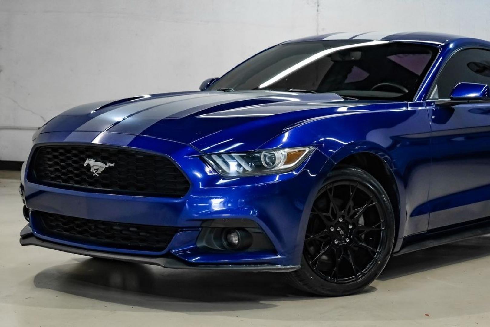 2016 Blue Metallic /Ebony Ford Mustang EcoBoost (1FA6P8TH7G5) with an EcoBoost 2.3L I4 GTDi DOHC Turbocharged VCT engine, Manual transmission, located at 15300 Midway Rd., Addison, TX, 75001, (972) 702-0011, 32.958321, -96.838074 - Photo#4