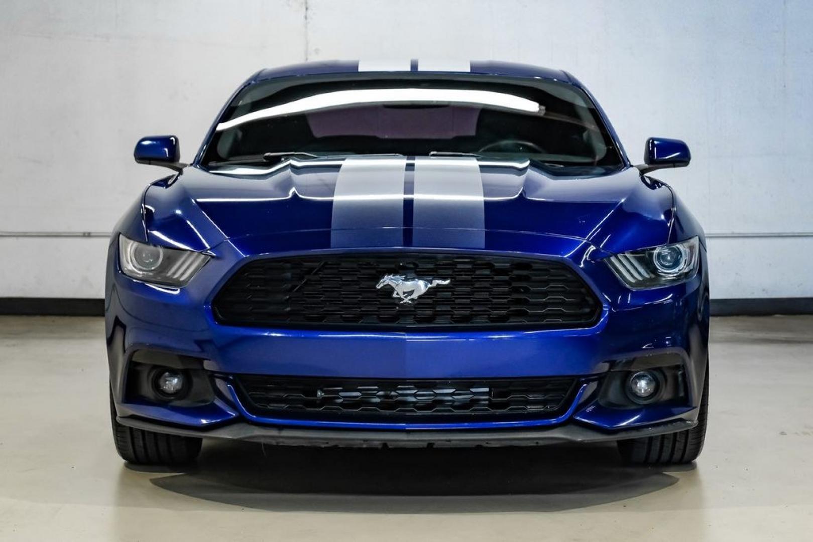 2016 Blue Metallic /Ebony Ford Mustang EcoBoost (1FA6P8TH7G5) with an EcoBoost 2.3L I4 GTDi DOHC Turbocharged VCT engine, Manual transmission, located at 15300 Midway Rd., Addison, TX, 75001, (972) 702-0011, 32.958321, -96.838074 - Photo#6