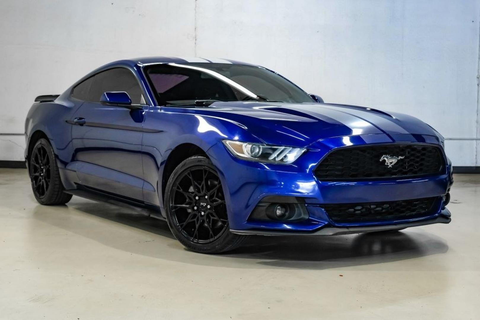 2016 Blue Metallic /Ebony Ford Mustang EcoBoost (1FA6P8TH7G5) with an EcoBoost 2.3L I4 GTDi DOHC Turbocharged VCT engine, Manual transmission, located at 15300 Midway Rd., Addison, TX, 75001, (972) 702-0011, 32.958321, -96.838074 - Photo#7