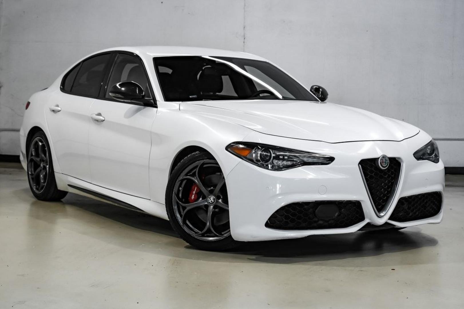 2019 White /Black Alfa Romeo Giulia Ti Sport Carbon (ZARFAMBN9K7) with an I4 engine, Automatic transmission, located at 15300 Midway Rd., Addison, TX, 75001, (972) 702-0011, 32.958321, -96.838074 - Photo#7