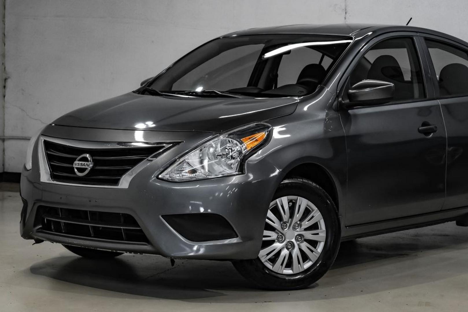 2019 Gun Metallic /Charcoal Nissan Versa 1.6 S Plus (3N1CN7APXKL) with an 1.6L 4-Cylinder DOHC 16V engine, CVT transmission, located at 15300 Midway Rd., Addison, TX, 75001, (972) 702-0011, 32.958321, -96.838074- Photo#3