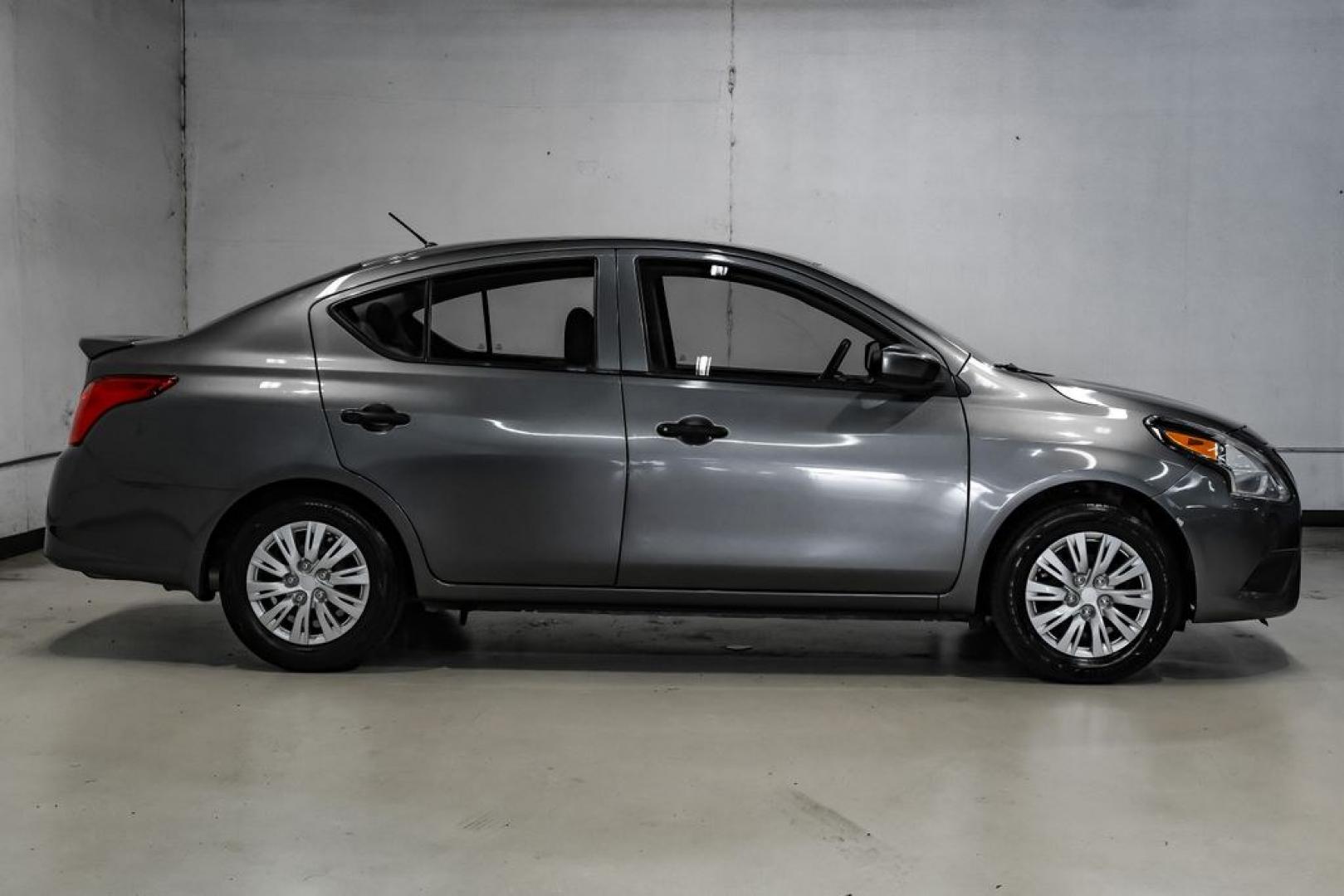 2019 Gun Metallic /Charcoal Nissan Versa 1.6 S Plus (3N1CN7APXKL) with an 1.6L 4-Cylinder DOHC 16V engine, CVT transmission, located at 15300 Midway Rd., Addison, TX, 75001, (972) 702-0011, 32.958321, -96.838074- Photo#7