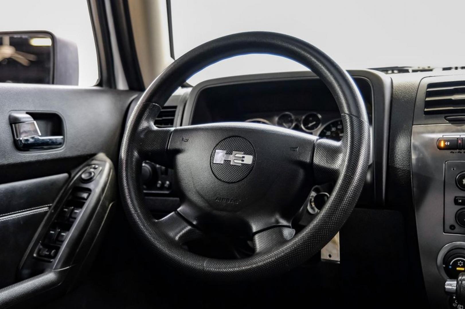 2009 Birch White /Ebony Hummer H3 Base (5GTEN13E998) with an 3.7L 5-Cylinder MPI DOHC engine, Automatic transmission, located at 15300 Midway Rd., Addison, TX, 75001, (972) 702-0011, 32.958321, -96.838074- Photo#23