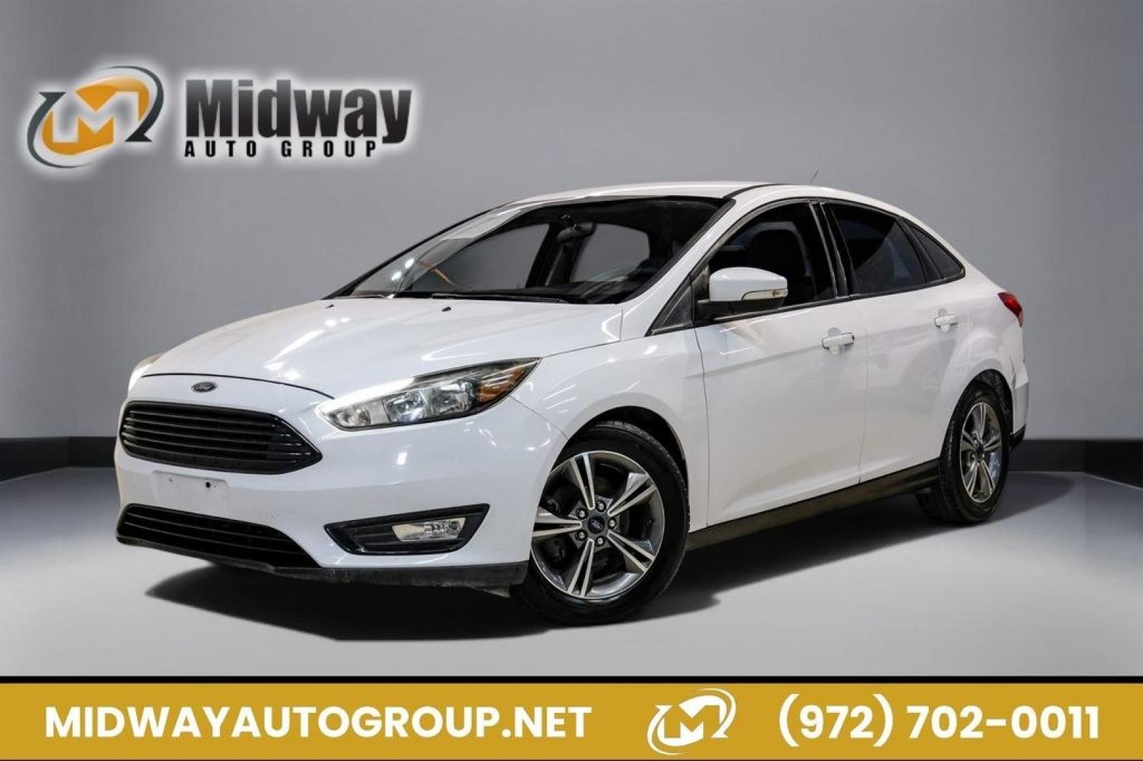 2017 Oxford White /Medium Light Stone Ford Focus SE (1FADP3FE0HL) with an EcoBoost 1.0L I3 GTDi DOHC Turbocharged VCT engine, Automatic transmission, located at 15300 Midway Rd., Addison, TX, 75001, (972) 702-0011, 32.958321, -96.838074- Photo#0