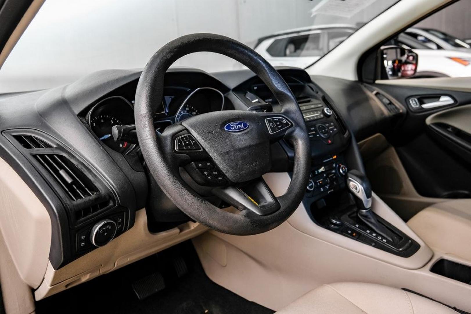 2017 Oxford White /Medium Light Stone Ford Focus SE (1FADP3FE0HL) with an EcoBoost 1.0L I3 GTDi DOHC Turbocharged VCT engine, Automatic transmission, located at 15300 Midway Rd., Addison, TX, 75001, (972) 702-0011, 32.958321, -96.838074- Photo#2