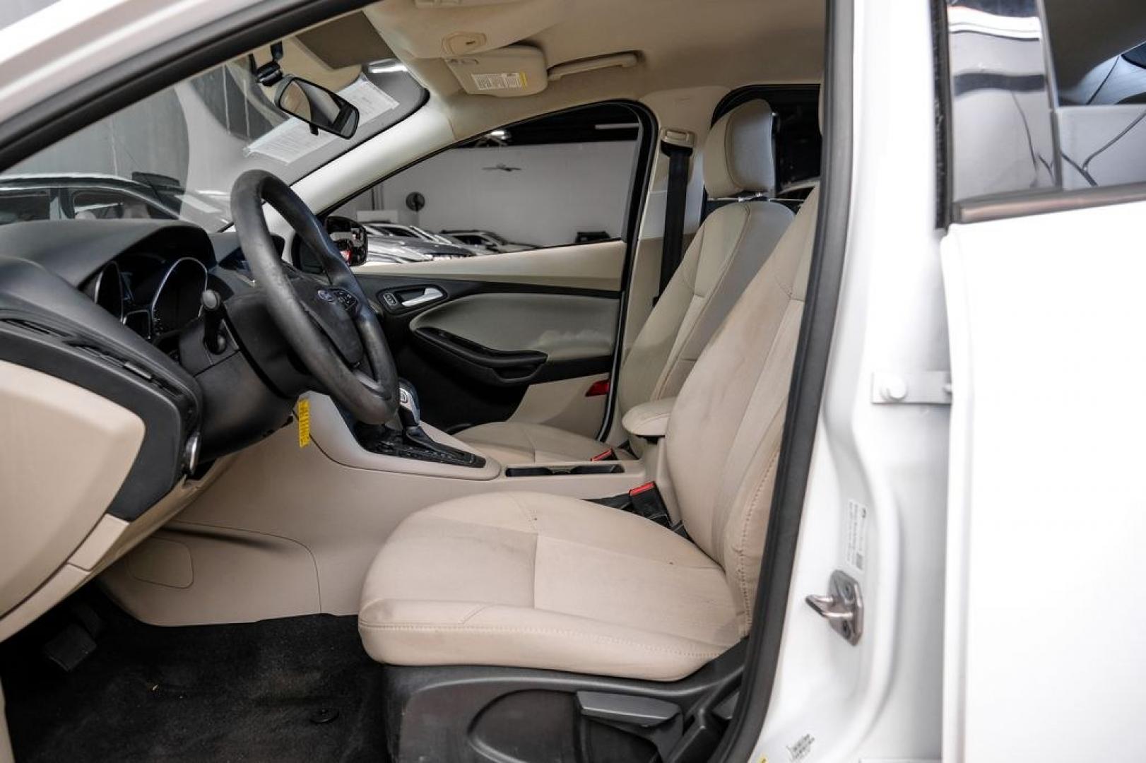 2017 Oxford White /Medium Light Stone Ford Focus SE (1FADP3FE0HL) with an EcoBoost 1.0L I3 GTDi DOHC Turbocharged VCT engine, Automatic transmission, located at 15300 Midway Rd., Addison, TX, 75001, (972) 702-0011, 32.958321, -96.838074- Photo#3