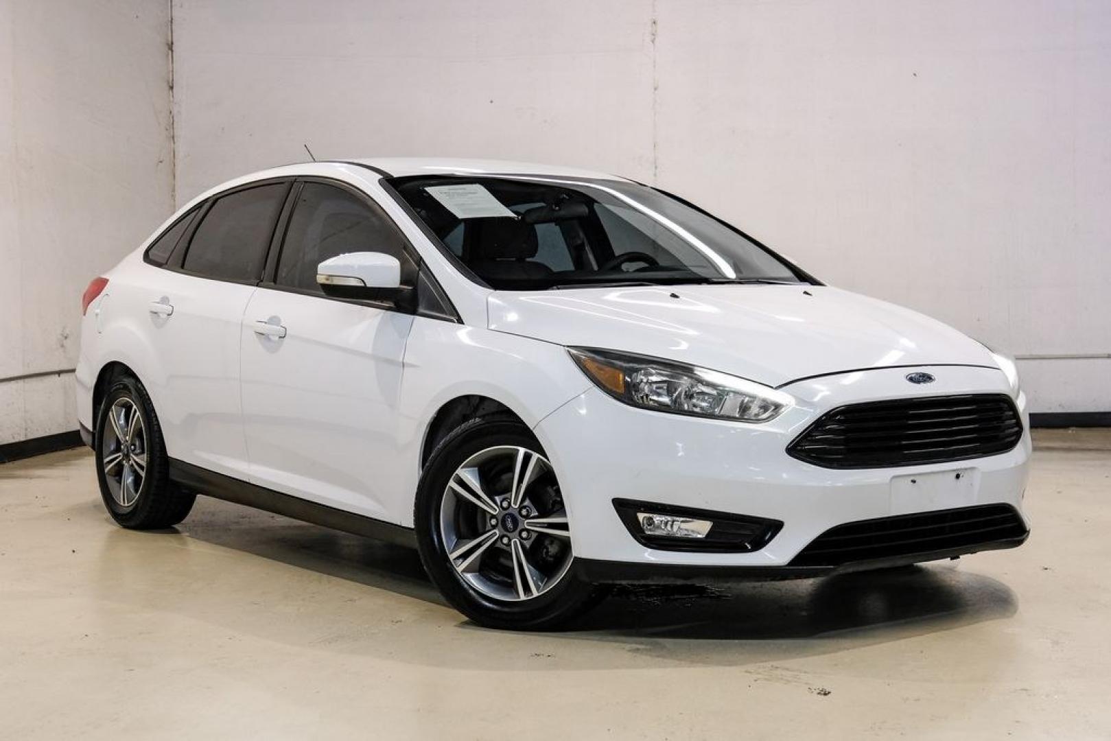 2017 Oxford White /Medium Light Stone Ford Focus SE (1FADP3FE0HL) with an EcoBoost 1.0L I3 GTDi DOHC Turbocharged VCT engine, Automatic transmission, located at 15300 Midway Rd., Addison, TX, 75001, (972) 702-0011, 32.958321, -96.838074- Photo#5