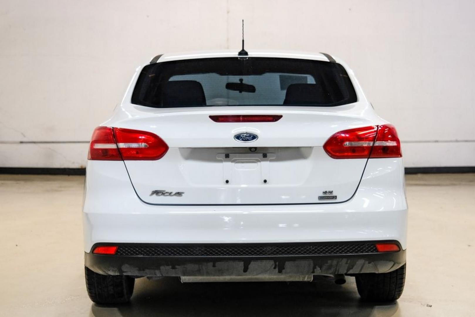 2017 Oxford White /Medium Light Stone Ford Focus SE (1FADP3FE0HL) with an EcoBoost 1.0L I3 GTDi DOHC Turbocharged VCT engine, Automatic transmission, located at 15300 Midway Rd., Addison, TX, 75001, (972) 702-0011, 32.958321, -96.838074- Photo#8