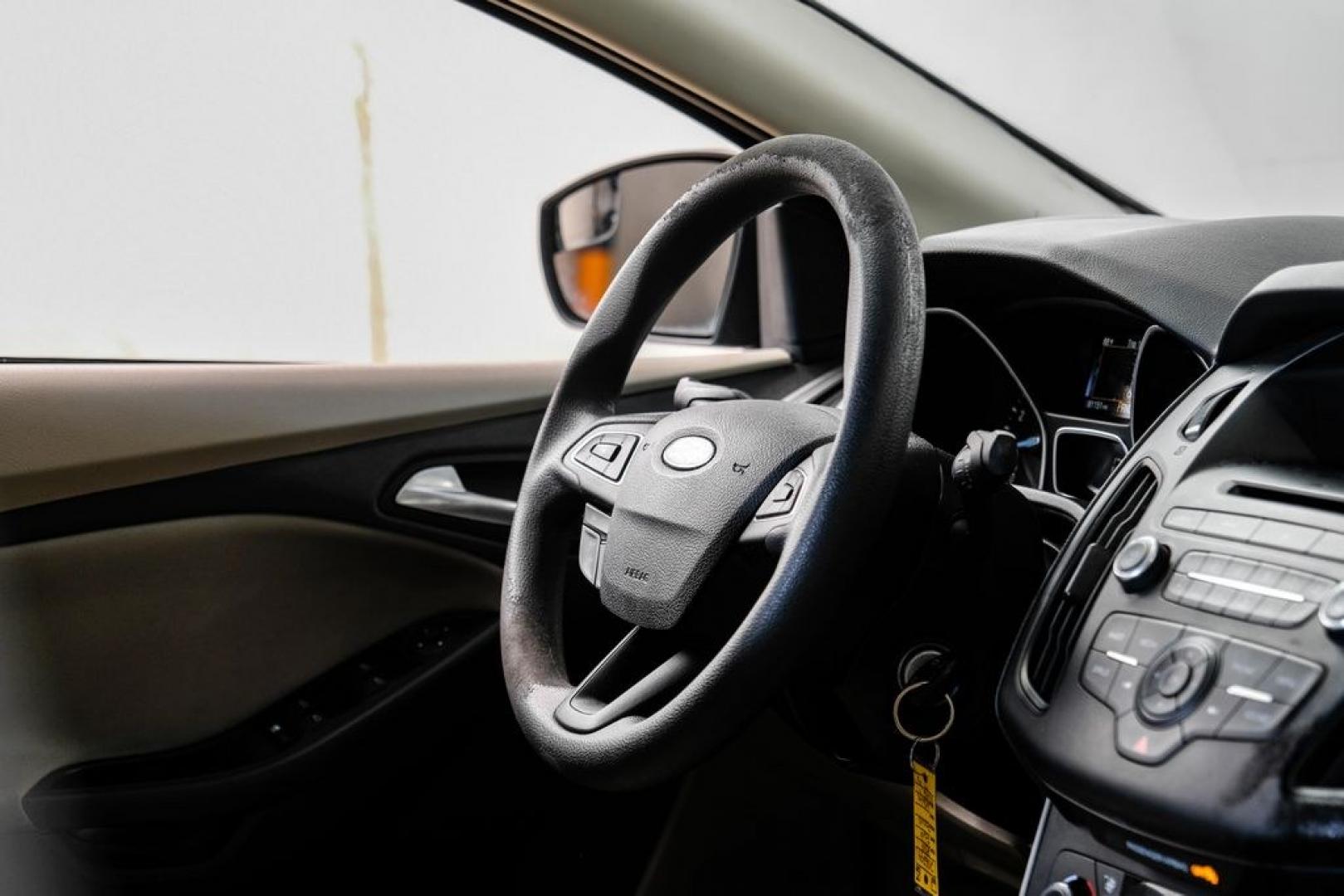 2017 Oxford White /Medium Light Stone Ford Focus SE (1FADP3FE0HL) with an EcoBoost 1.0L I3 GTDi DOHC Turbocharged VCT engine, Automatic transmission, located at 15300 Midway Rd., Addison, TX, 75001, (972) 702-0011, 32.958321, -96.838074- Photo#14