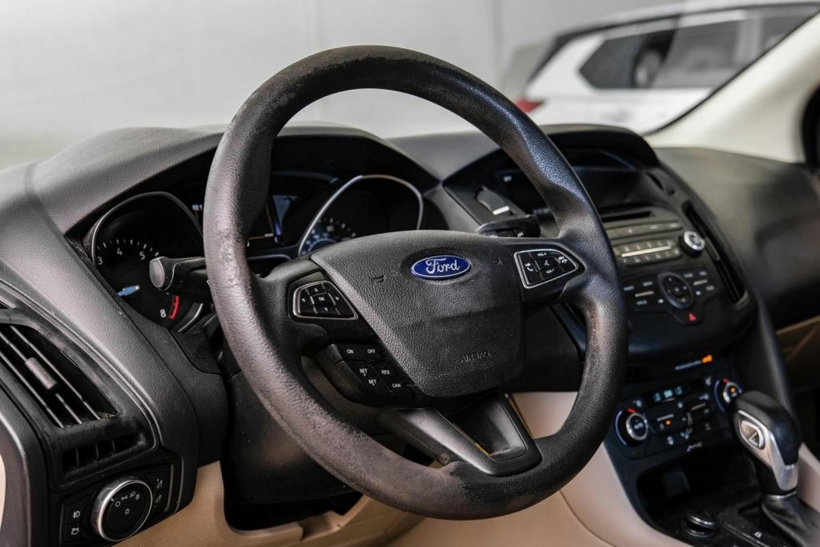 2017 Oxford White /Medium Light Stone Ford Focus SE (1FADP3FE0HL) with an EcoBoost 1.0L I3 GTDi DOHC Turbocharged VCT engine, Automatic transmission, located at 15300 Midway Rd., Addison, TX, 75001, (972) 702-0011, 32.958321, -96.838074- Photo#16