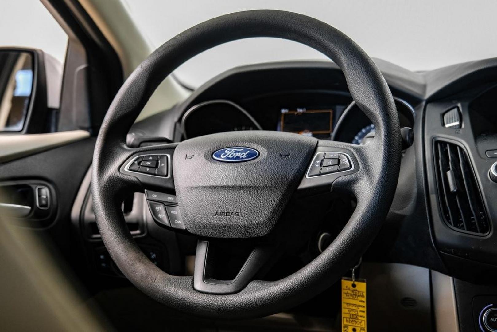 2017 Oxford White /Medium Light Stone Ford Focus SE (1FADP3FE0HL) with an EcoBoost 1.0L I3 GTDi DOHC Turbocharged VCT engine, Automatic transmission, located at 15300 Midway Rd., Addison, TX, 75001, (972) 702-0011, 32.958321, -96.838074- Photo#17
