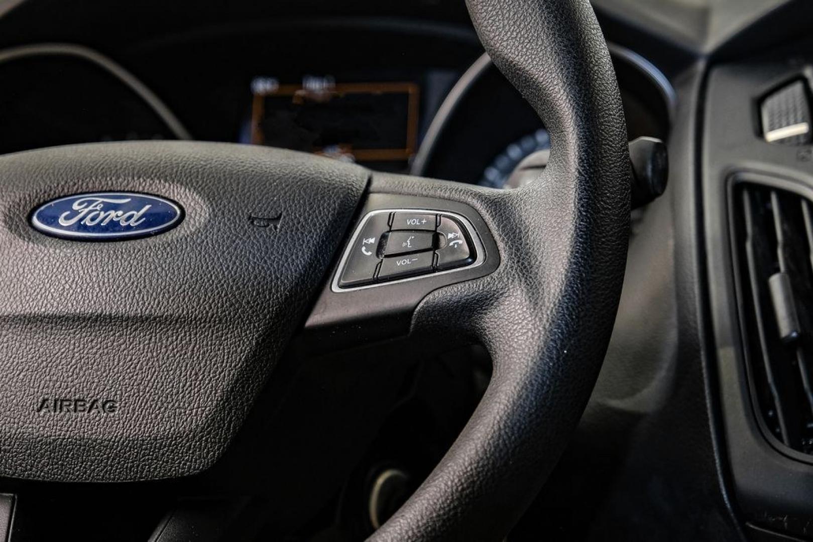 2017 Oxford White /Medium Light Stone Ford Focus SE (1FADP3FE0HL) with an EcoBoost 1.0L I3 GTDi DOHC Turbocharged VCT engine, Automatic transmission, located at 15300 Midway Rd., Addison, TX, 75001, (972) 702-0011, 32.958321, -96.838074- Photo#19