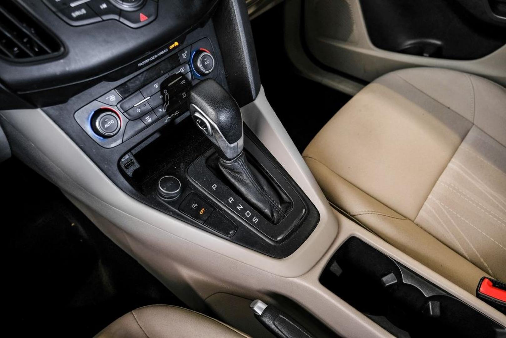 2017 Oxford White /Medium Light Stone Ford Focus SE (1FADP3FE0HL) with an EcoBoost 1.0L I3 GTDi DOHC Turbocharged VCT engine, Automatic transmission, located at 15300 Midway Rd., Addison, TX, 75001, (972) 702-0011, 32.958321, -96.838074- Photo#24