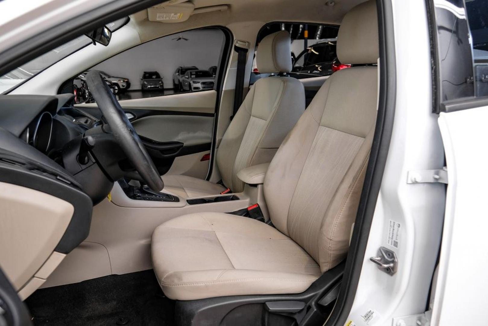 2017 Oxford White /Medium Light Stone Ford Focus SE (1FADP3FE0HL) with an EcoBoost 1.0L I3 GTDi DOHC Turbocharged VCT engine, Automatic transmission, located at 15300 Midway Rd., Addison, TX, 75001, (972) 702-0011, 32.958321, -96.838074- Photo#30