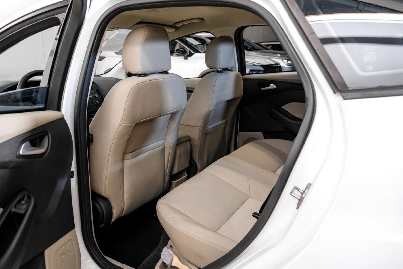 2017 Oxford White /Medium Light Stone Ford Focus SE (1FADP3FE0HL) with an EcoBoost 1.0L I3 GTDi DOHC Turbocharged VCT engine, Automatic transmission, located at 15300 Midway Rd., Addison, TX, 75001, (972) 702-0011, 32.958321, -96.838074- Photo#34
