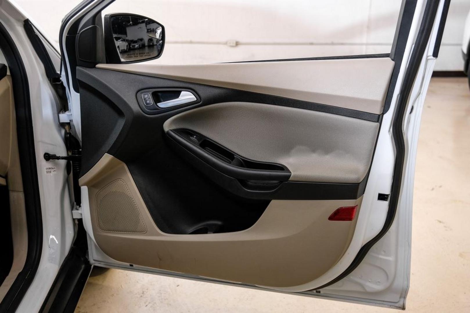 2017 Oxford White /Medium Light Stone Ford Focus SE (1FADP3FE0HL) with an EcoBoost 1.0L I3 GTDi DOHC Turbocharged VCT engine, Automatic transmission, located at 15300 Midway Rd., Addison, TX, 75001, (972) 702-0011, 32.958321, -96.838074- Photo#41