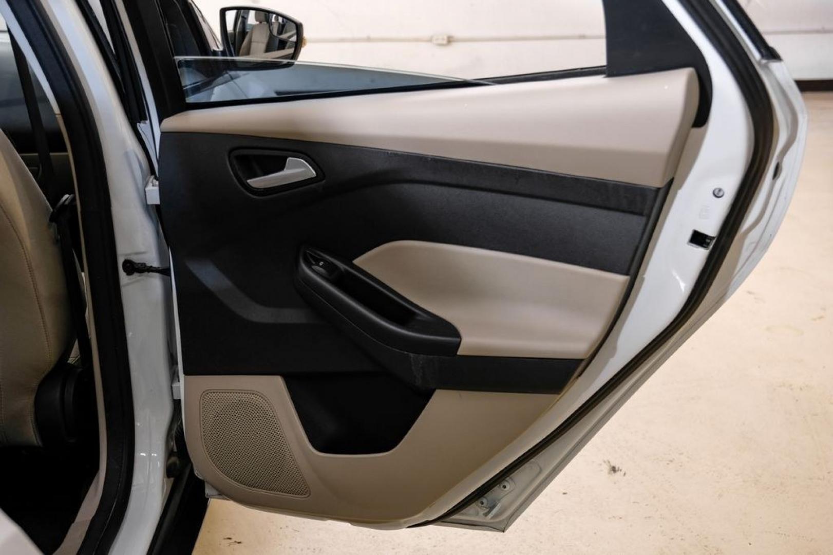 2017 Oxford White /Medium Light Stone Ford Focus SE (1FADP3FE0HL) with an EcoBoost 1.0L I3 GTDi DOHC Turbocharged VCT engine, Automatic transmission, located at 15300 Midway Rd., Addison, TX, 75001, (972) 702-0011, 32.958321, -96.838074- Photo#43