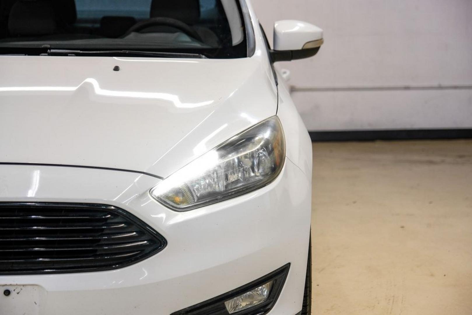 2017 Oxford White /Medium Light Stone Ford Focus SE (1FADP3FE0HL) with an EcoBoost 1.0L I3 GTDi DOHC Turbocharged VCT engine, Automatic transmission, located at 15300 Midway Rd., Addison, TX, 75001, (972) 702-0011, 32.958321, -96.838074- Photo#44