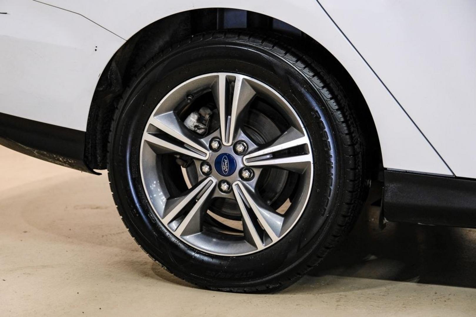 2017 Oxford White /Medium Light Stone Ford Focus SE (1FADP3FE0HL) with an EcoBoost 1.0L I3 GTDi DOHC Turbocharged VCT engine, Automatic transmission, located at 15300 Midway Rd., Addison, TX, 75001, (972) 702-0011, 32.958321, -96.838074- Photo#51