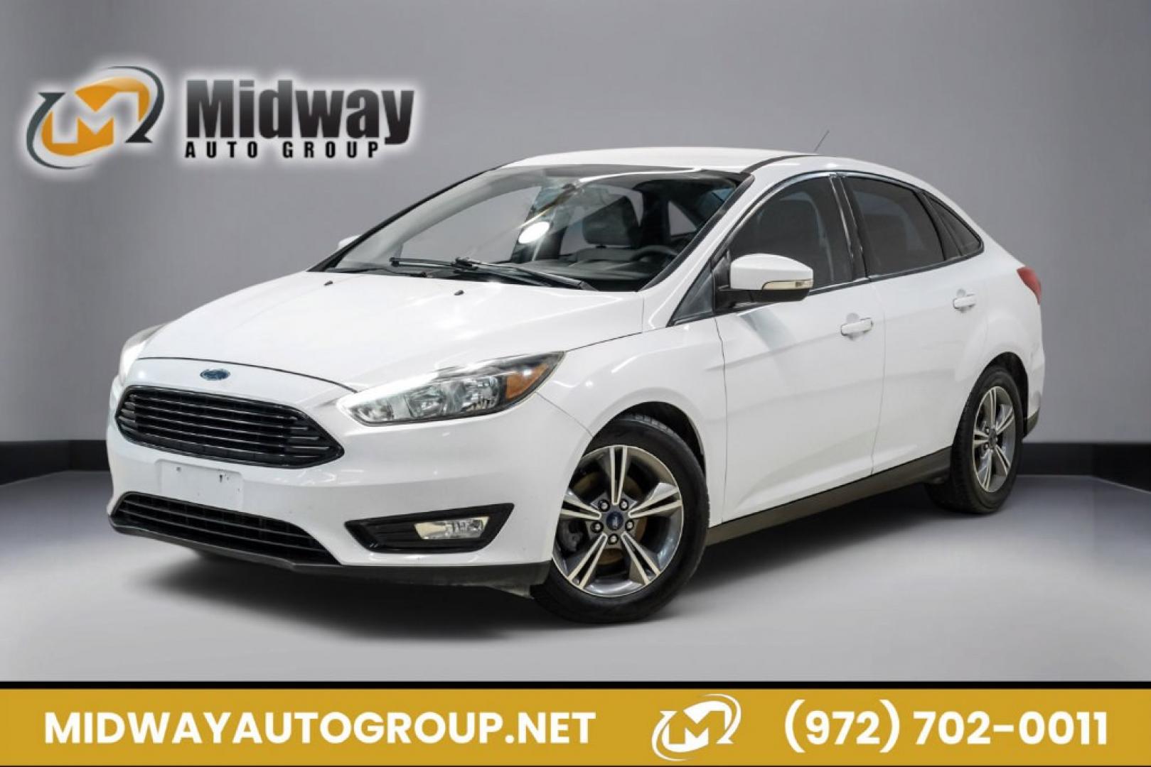 2017 Oxford White /Medium Light Stone Ford Focus SE (1FADP3FE0HL) with an EcoBoost 1.0L I3 GTDi DOHC Turbocharged VCT engine, Automatic transmission, located at 15300 Midway Rd., Addison, TX, 75001, (972) 702-0011, 32.958321, -96.838074- Photo#0