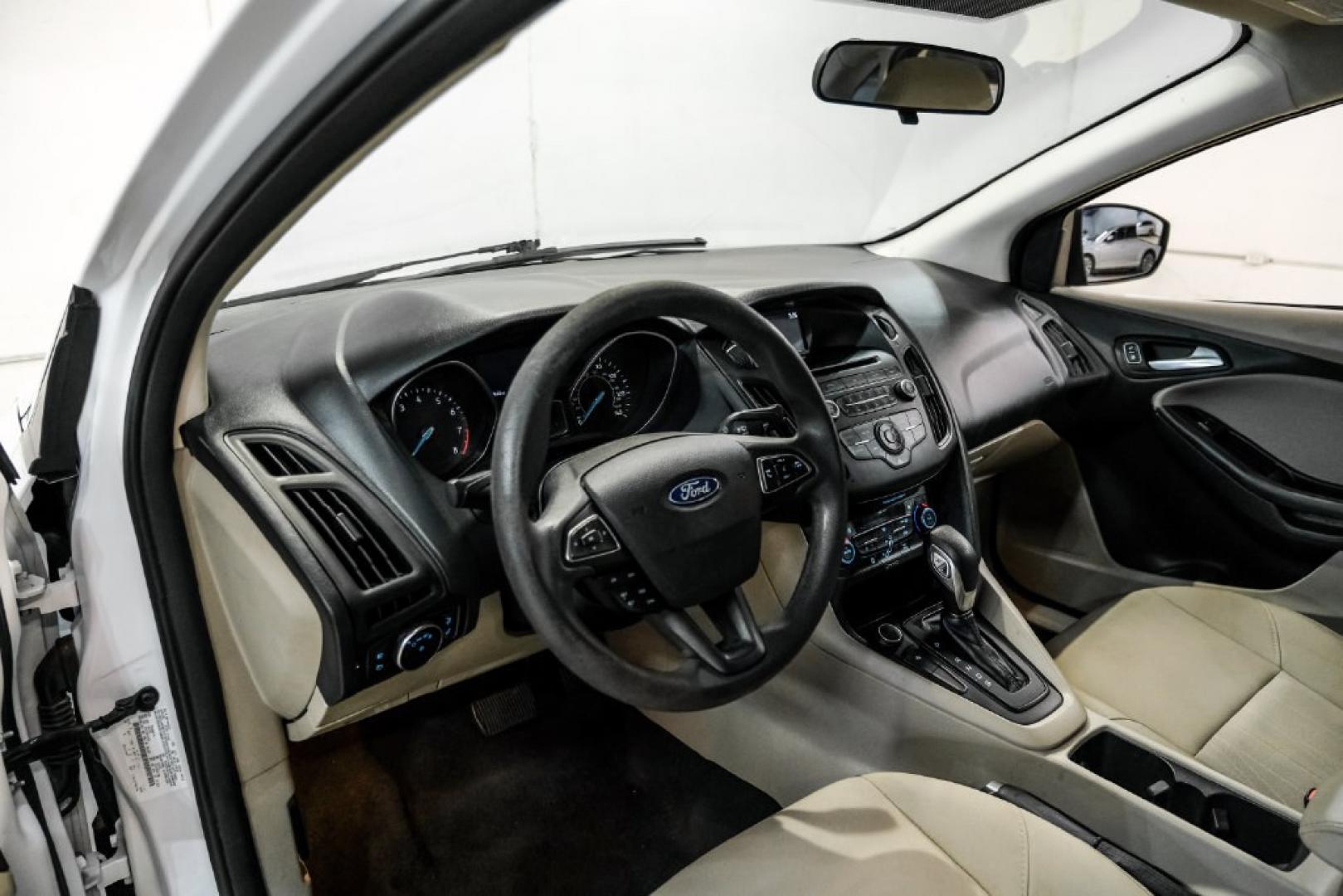 2017 Oxford White /Medium Light Stone Ford Focus SE (1FADP3FE0HL) with an EcoBoost 1.0L I3 GTDi DOHC Turbocharged VCT engine, Automatic transmission, located at 15300 Midway Rd., Addison, TX, 75001, (972) 702-0011, 32.958321, -96.838074- Photo#2