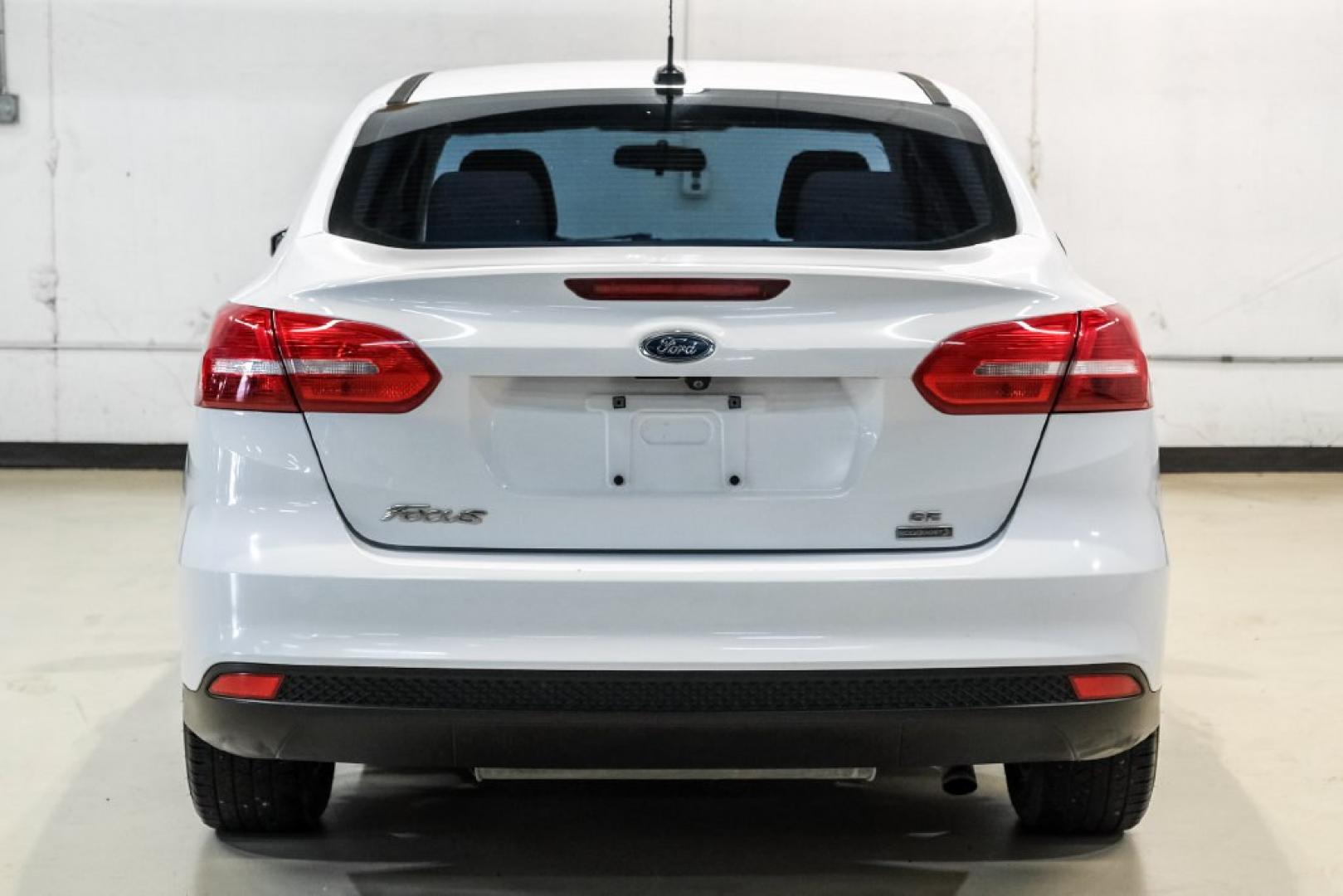 2017 Oxford White /Medium Light Stone Ford Focus SE (1FADP3FE0HL) with an EcoBoost 1.0L I3 GTDi DOHC Turbocharged VCT engine, Automatic transmission, located at 15300 Midway Rd., Addison, TX, 75001, (972) 702-0011, 32.958321, -96.838074- Photo#8