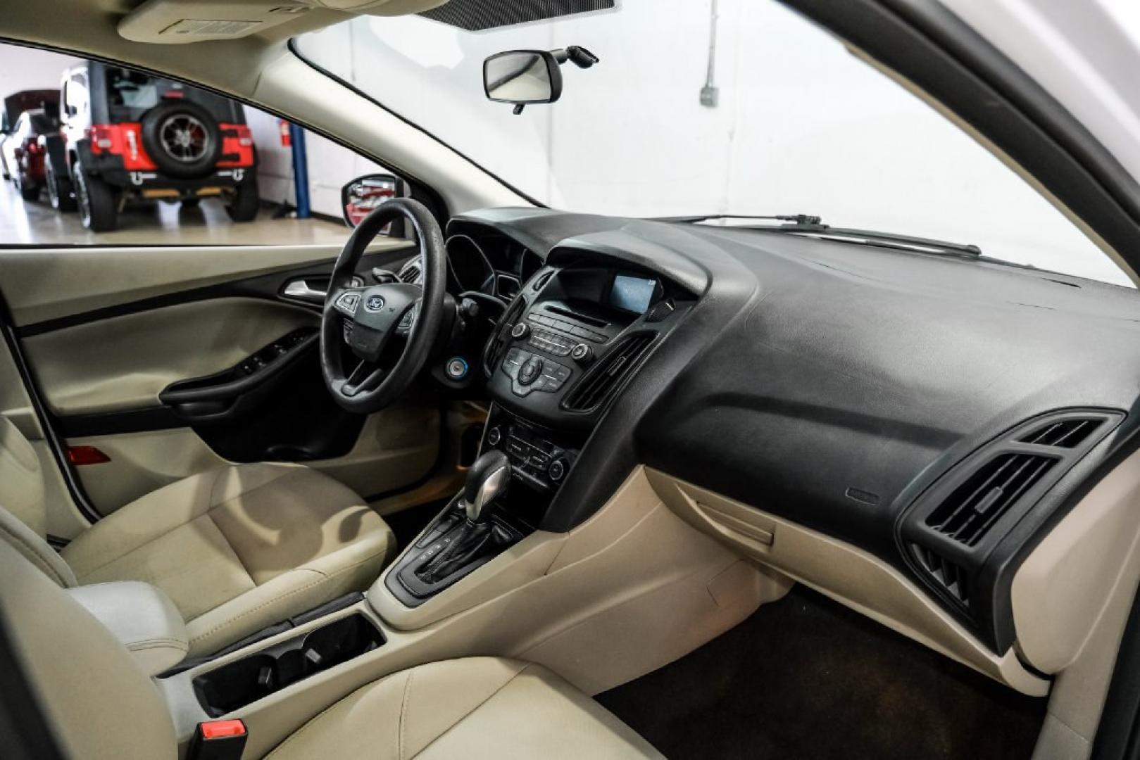 2017 Oxford White /Medium Light Stone Ford Focus SE (1FADP3FE0HL) with an EcoBoost 1.0L I3 GTDi DOHC Turbocharged VCT engine, Automatic transmission, located at 15300 Midway Rd., Addison, TX, 75001, (972) 702-0011, 32.958321, -96.838074- Photo#13