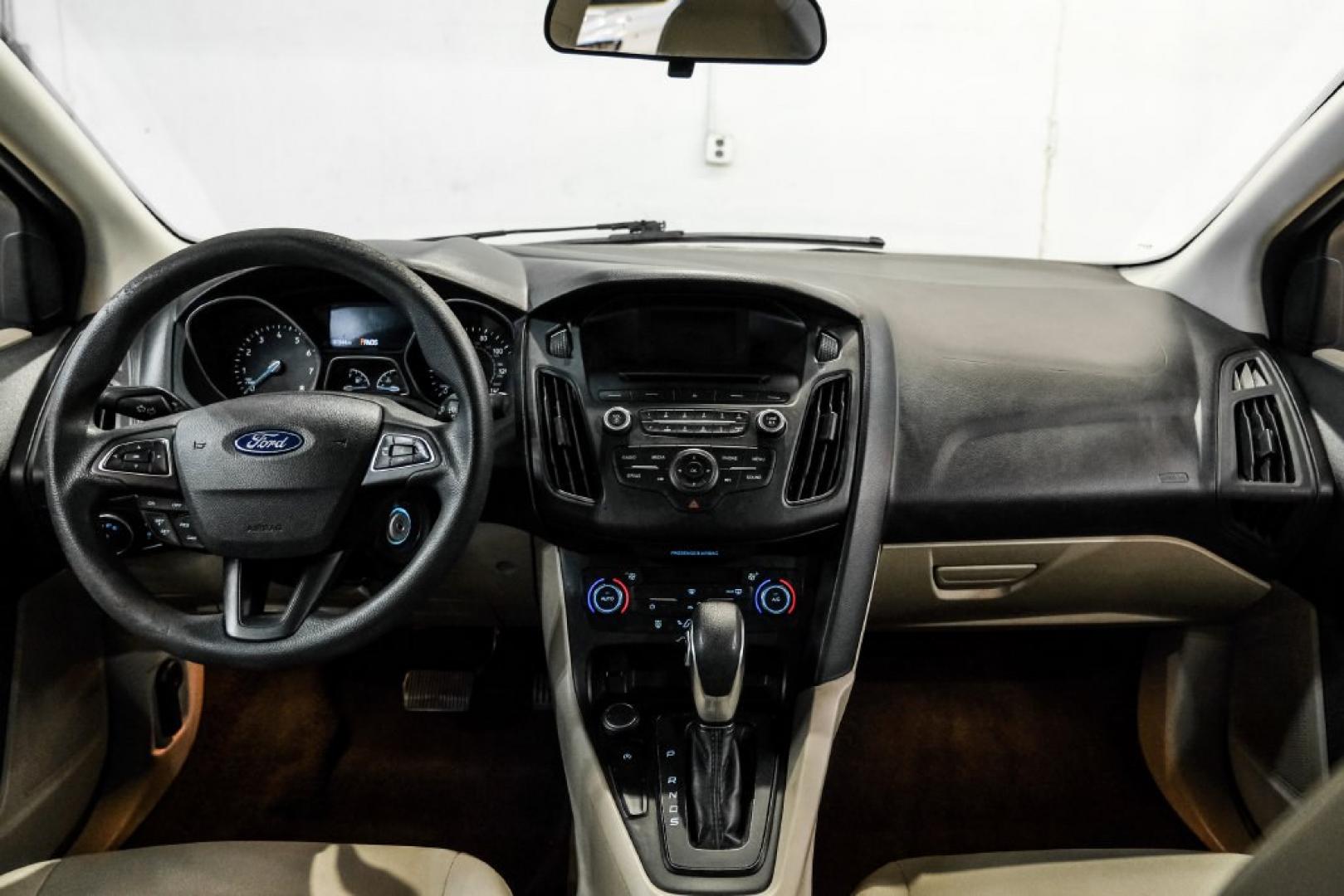 2017 Oxford White /Medium Light Stone Ford Focus SE (1FADP3FE0HL) with an EcoBoost 1.0L I3 GTDi DOHC Turbocharged VCT engine, Automatic transmission, located at 15300 Midway Rd., Addison, TX, 75001, (972) 702-0011, 32.958321, -96.838074- Photo#14