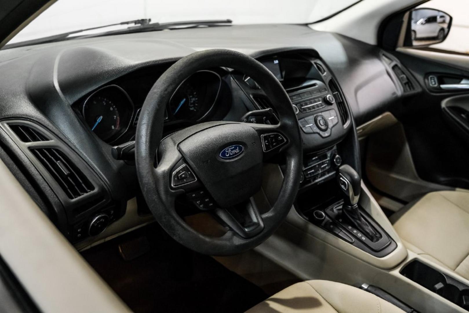 2017 Oxford White /Medium Light Stone Ford Focus SE (1FADP3FE0HL) with an EcoBoost 1.0L I3 GTDi DOHC Turbocharged VCT engine, Automatic transmission, located at 15300 Midway Rd., Addison, TX, 75001, (972) 702-0011, 32.958321, -96.838074- Photo#16