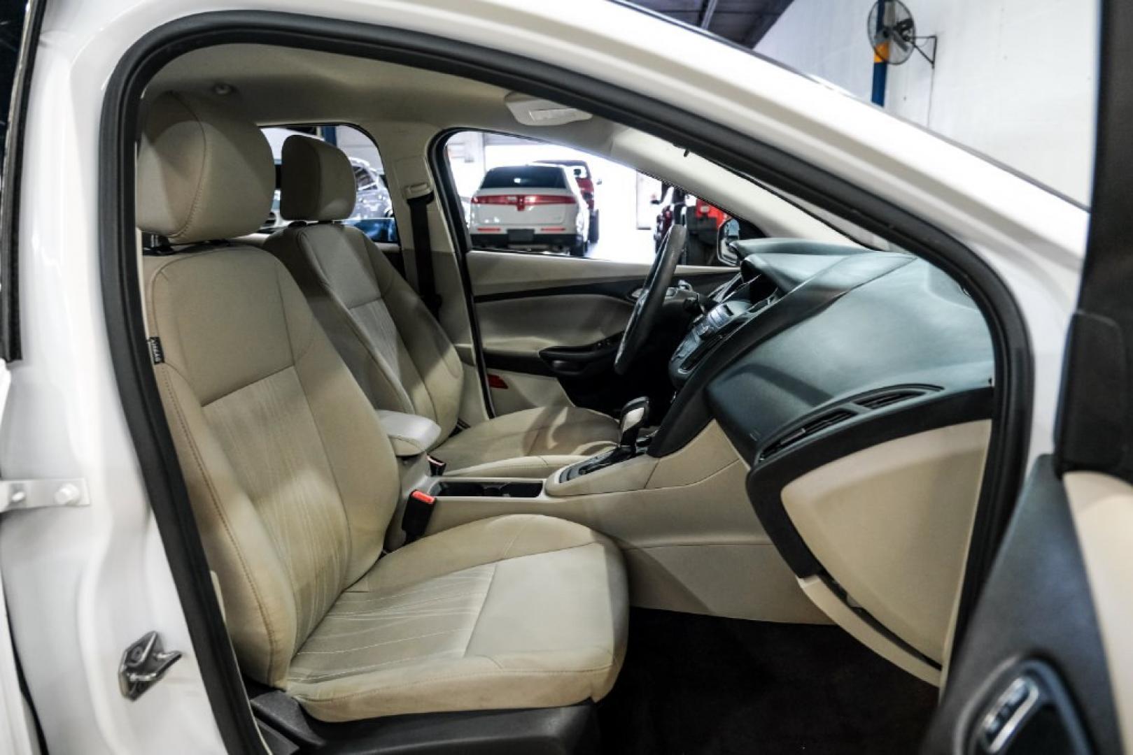 2017 Oxford White /Medium Light Stone Ford Focus SE (1FADP3FE0HL) with an EcoBoost 1.0L I3 GTDi DOHC Turbocharged VCT engine, Automatic transmission, located at 15300 Midway Rd., Addison, TX, 75001, (972) 702-0011, 32.958321, -96.838074- Photo#32