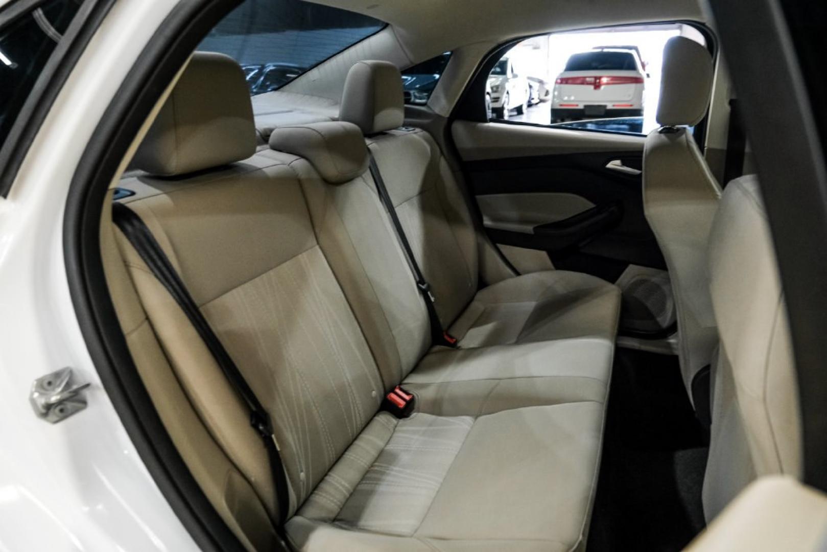 2017 Oxford White /Medium Light Stone Ford Focus SE (1FADP3FE0HL) with an EcoBoost 1.0L I3 GTDi DOHC Turbocharged VCT engine, Automatic transmission, located at 15300 Midway Rd., Addison, TX, 75001, (972) 702-0011, 32.958321, -96.838074- Photo#34